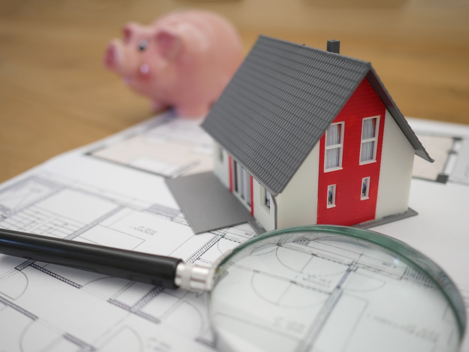 House, magnifying glass, pig, paper
