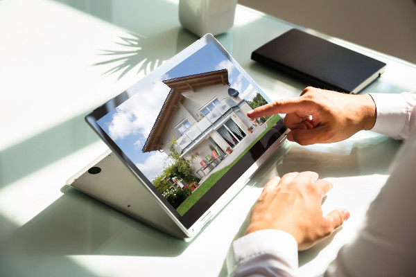 Looking at a house on a tablet