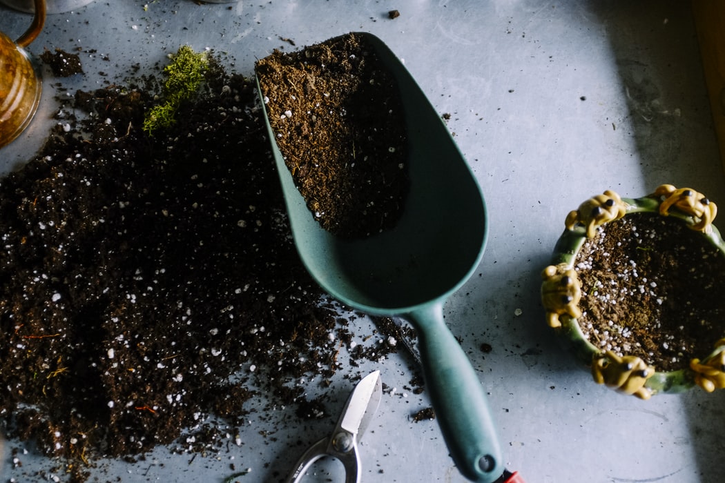Garden tools, pot, soil