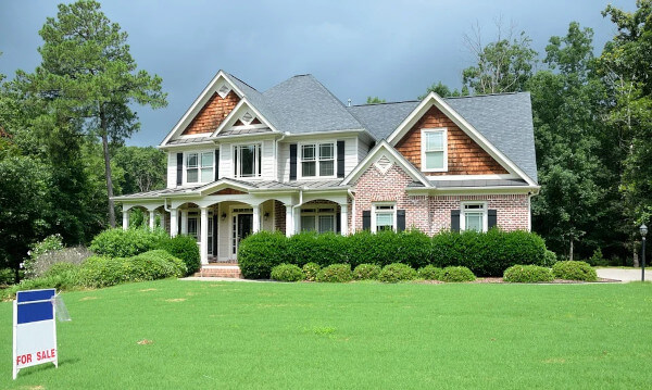 House for sale. blue sky, green grass