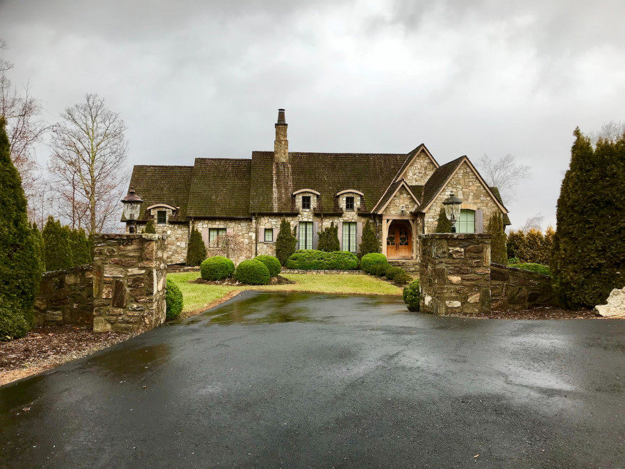 Large brick house, cloudy, grey sky