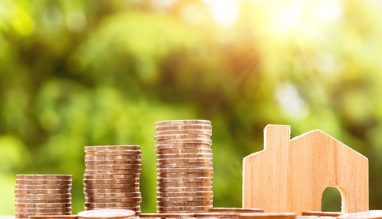 coins stacked on a table. Image by Pexels