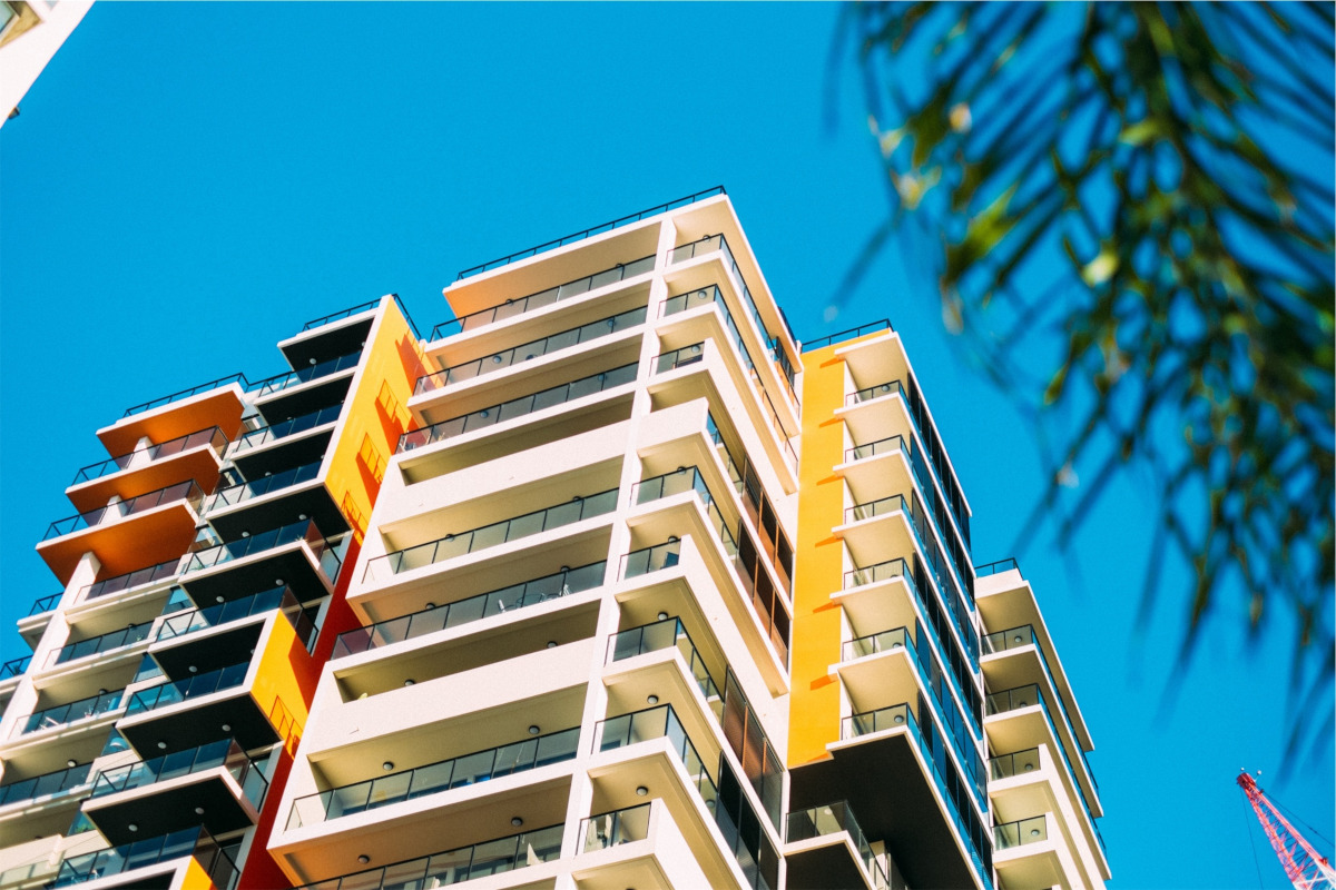 Condo buildings. Blue sky. Image by Peakpx