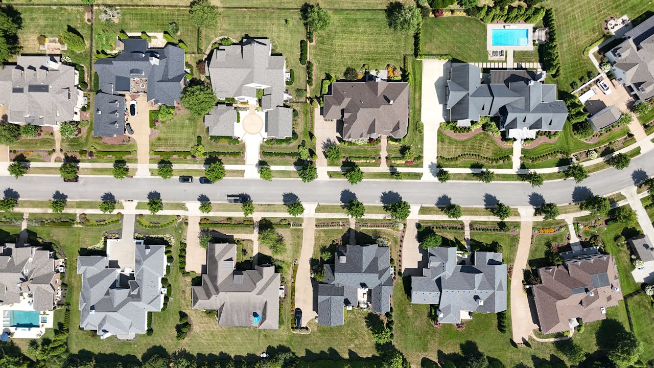 Aerial view of a master-planned community with homes. Image by Pexels
