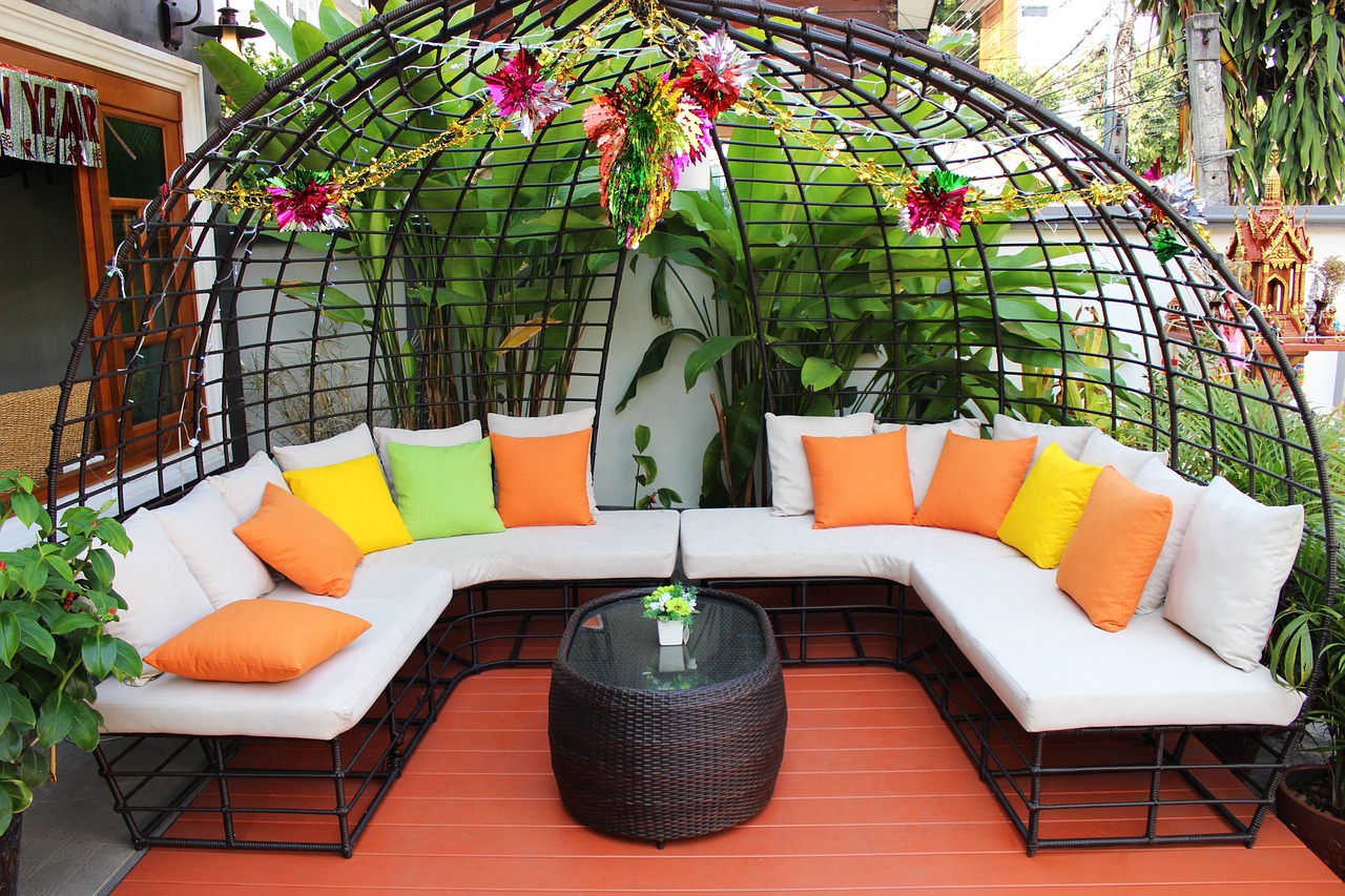 Outdoor seating with coloful pillows. Image by Pixabay