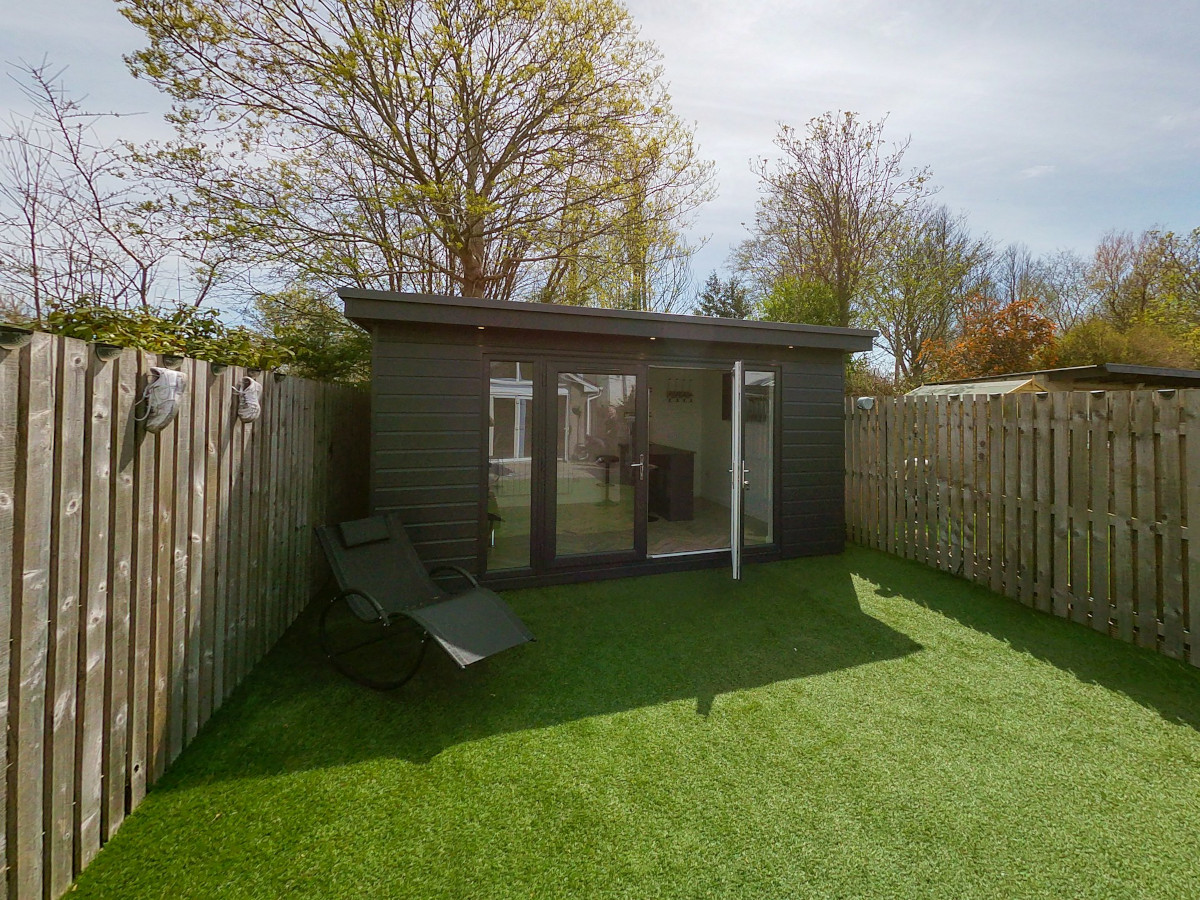 Small garden room in a backyard. Image by Unsplash