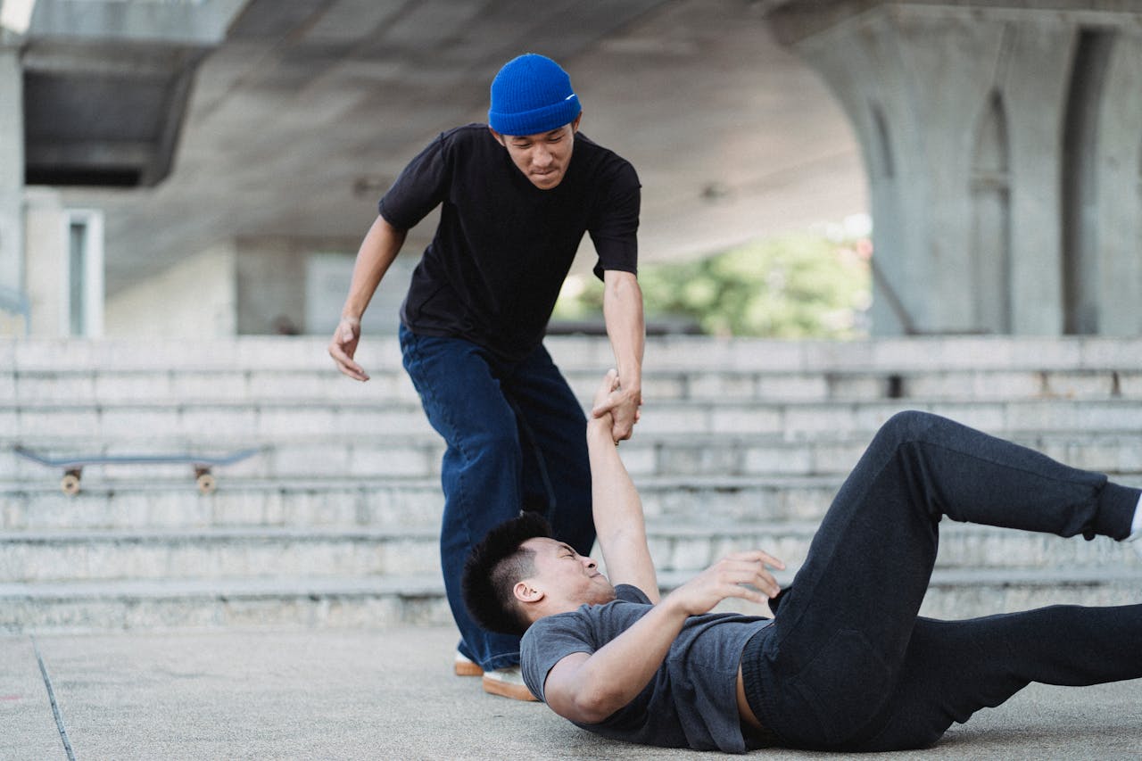 Person helping someone that fell down