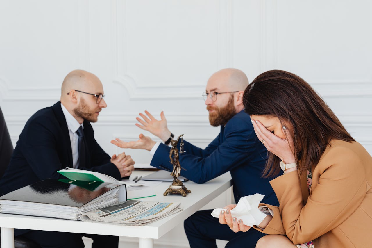 Two people talking, woman crying. Image by Pexels