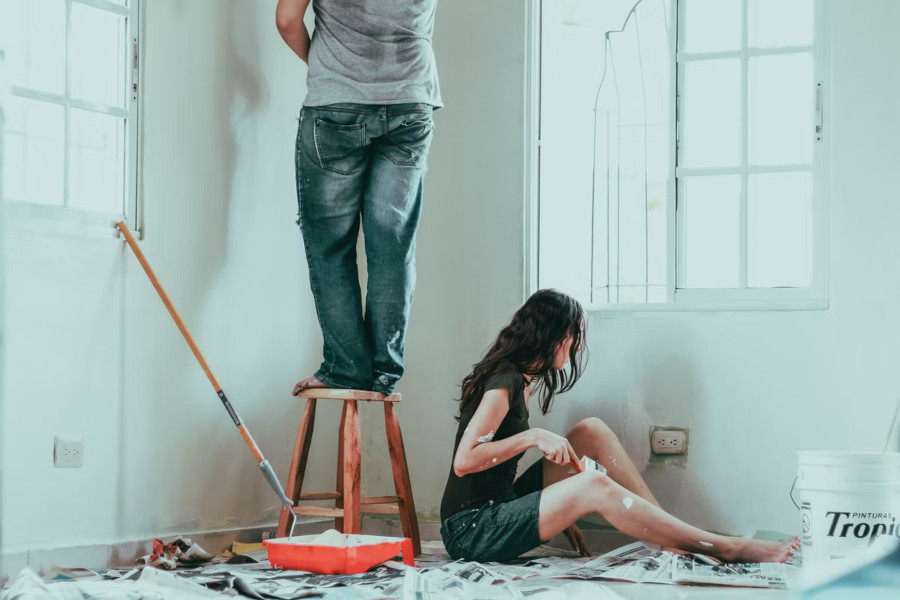 2 people painting a room