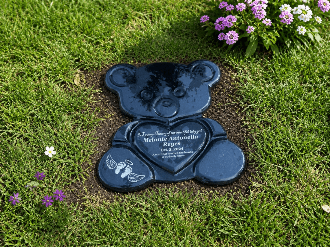 Flush granite flat headstone marker set level with the turf in a modern lawn cemetery showing the continuous landscape composition. Image by Remembrance Headstones