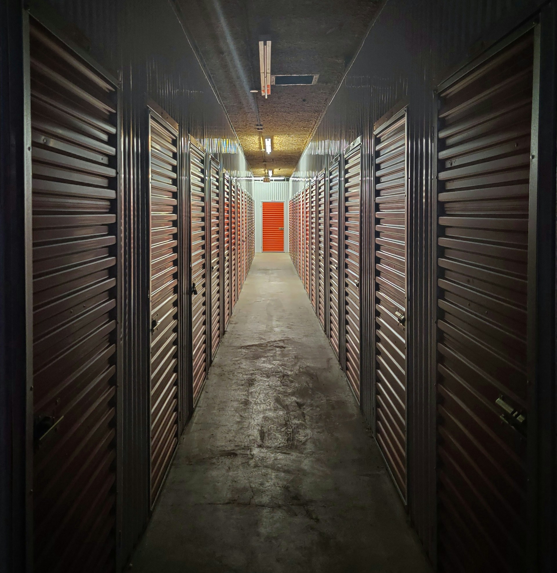 Empty hallway with lots of storage units. Image by Unsplash