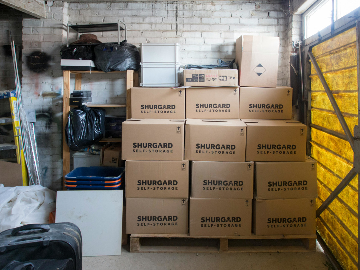 Stacked storage boxes in warehouse interior. Image by Pexels