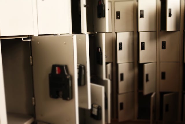 Grey metal lockers open. Image by Pexels