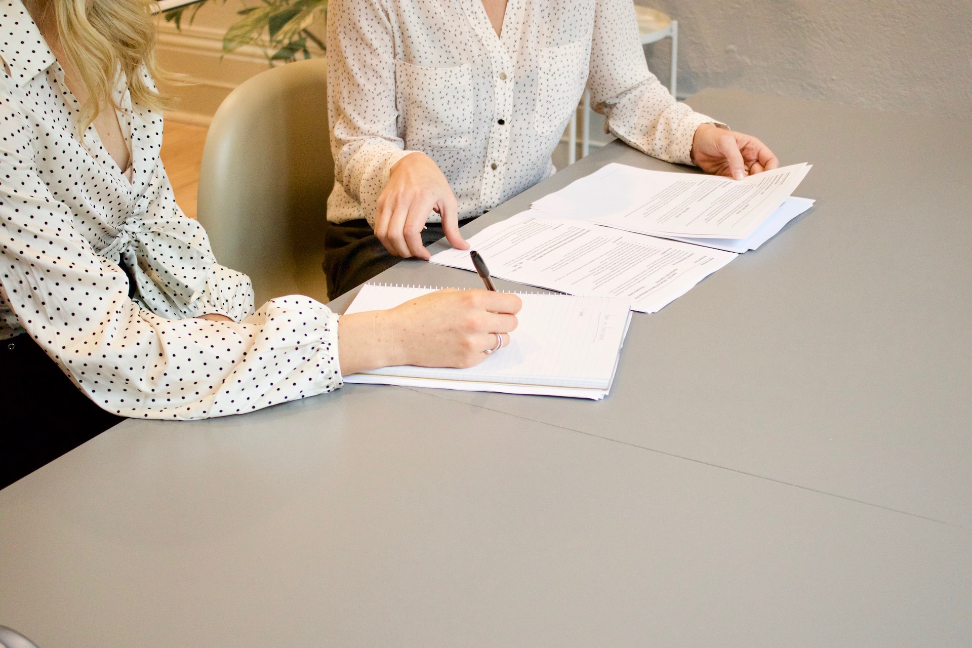 two people with paperwork