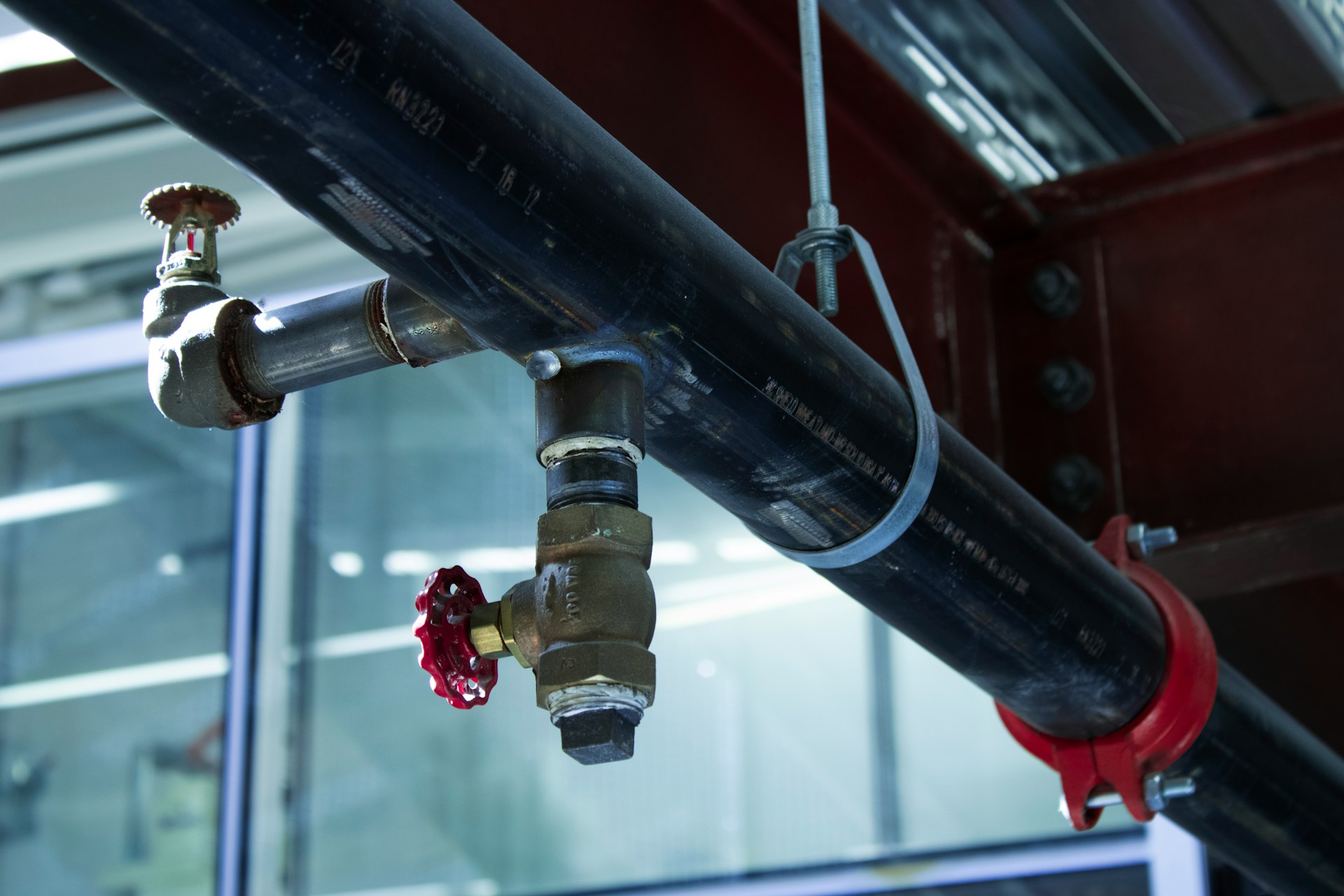 Pipes connected to a building. Image by Unsplash