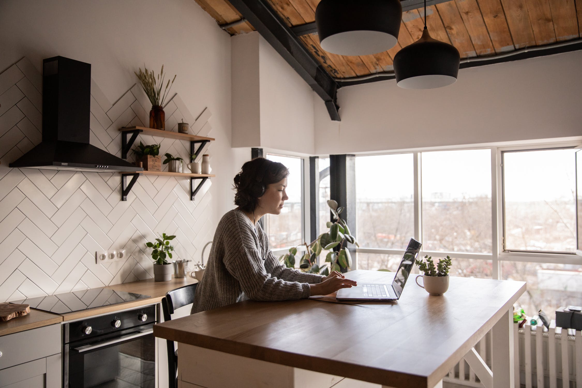 Person on the computer in the kitchen