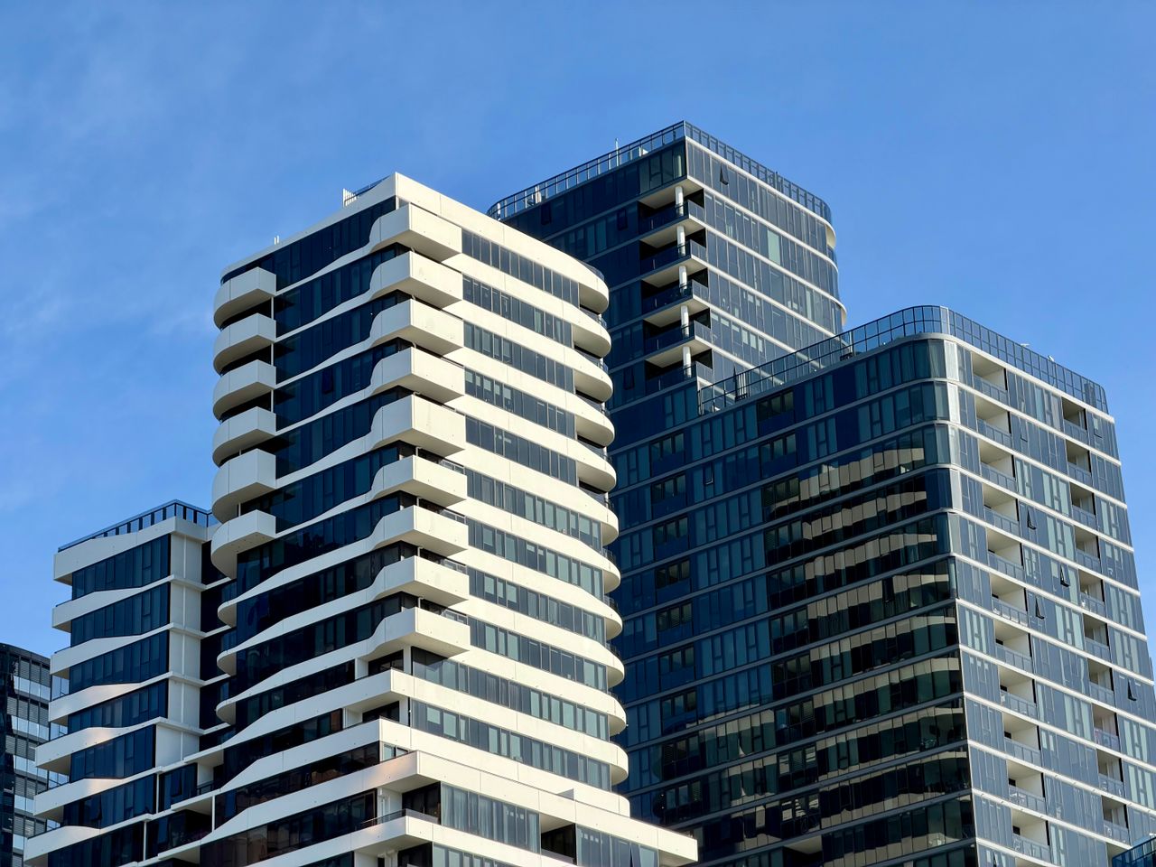 Contemporary high-rise buildings in Box Hill, Victoria under clear blue sky. Image by Pexels