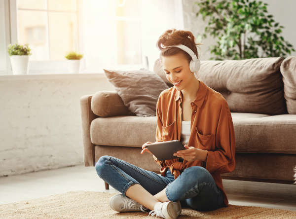 Person sitting on floor. Sofa.