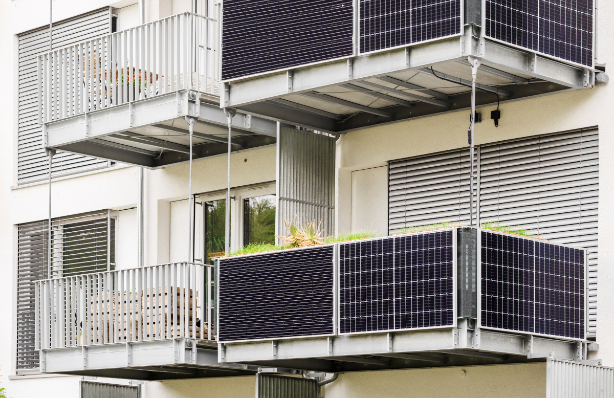 apartment building with solar panels on the balconies.