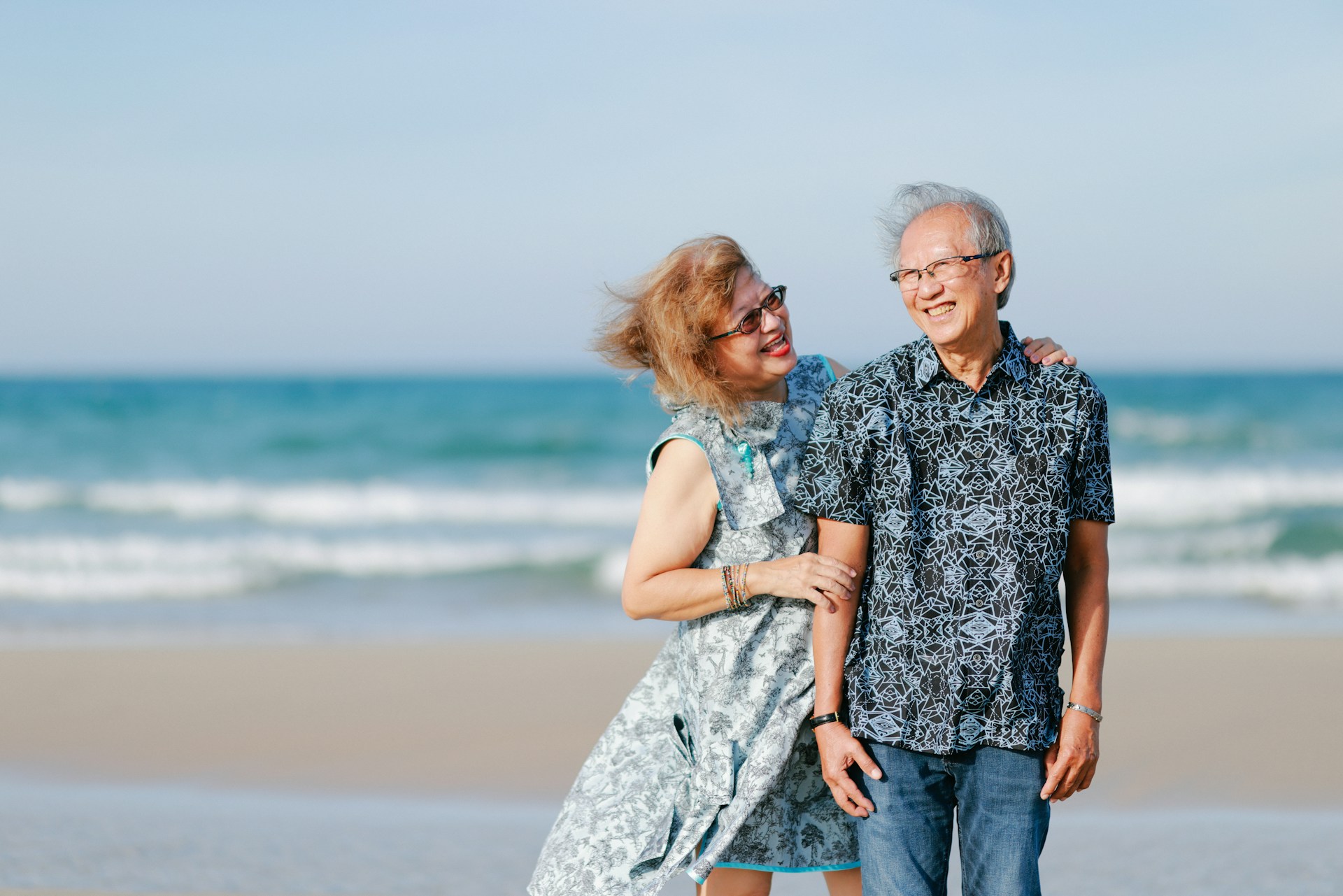 A happy couple on a beach. Image by Unsplash