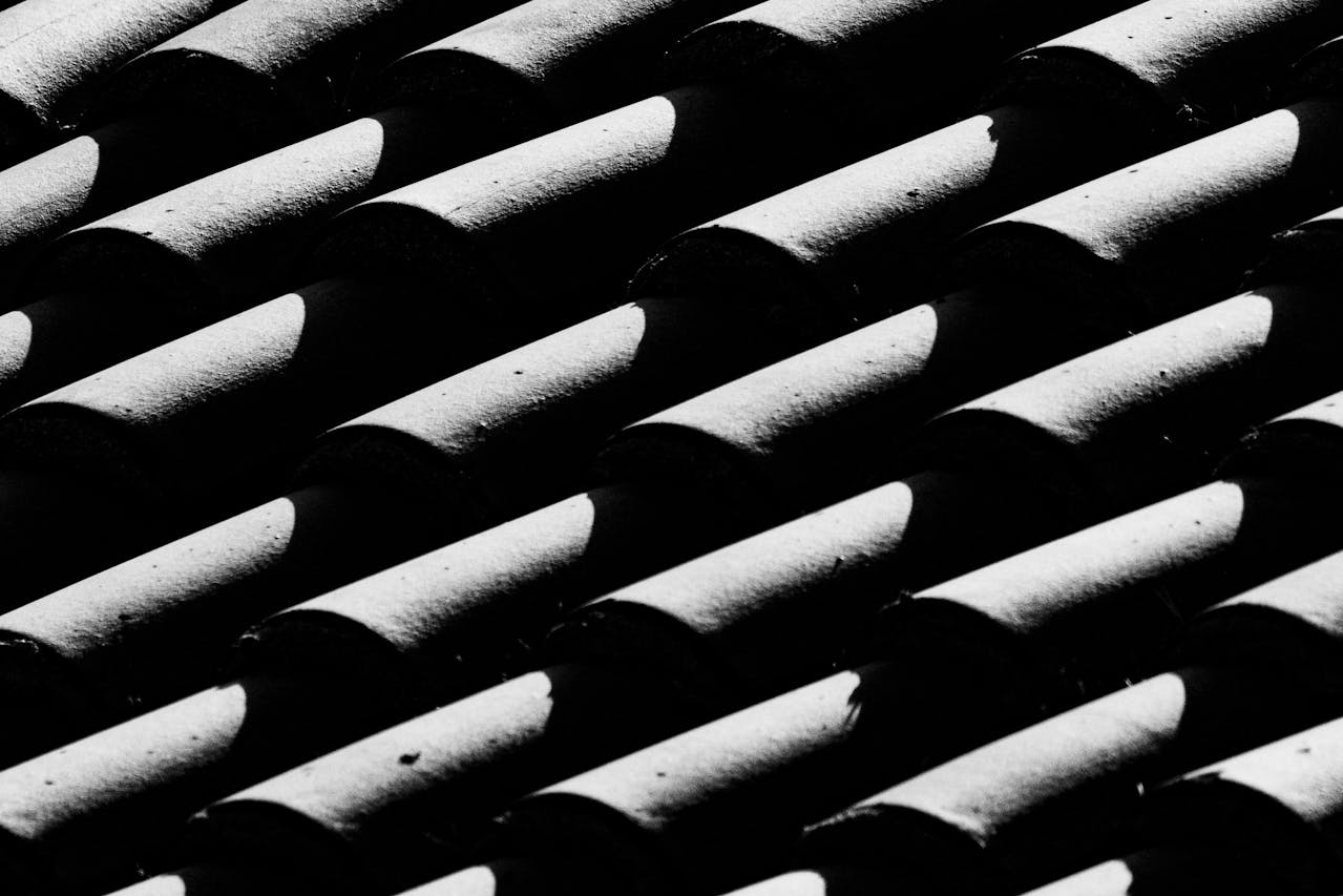 Black and white image of roofing tiles. Image by Pexels