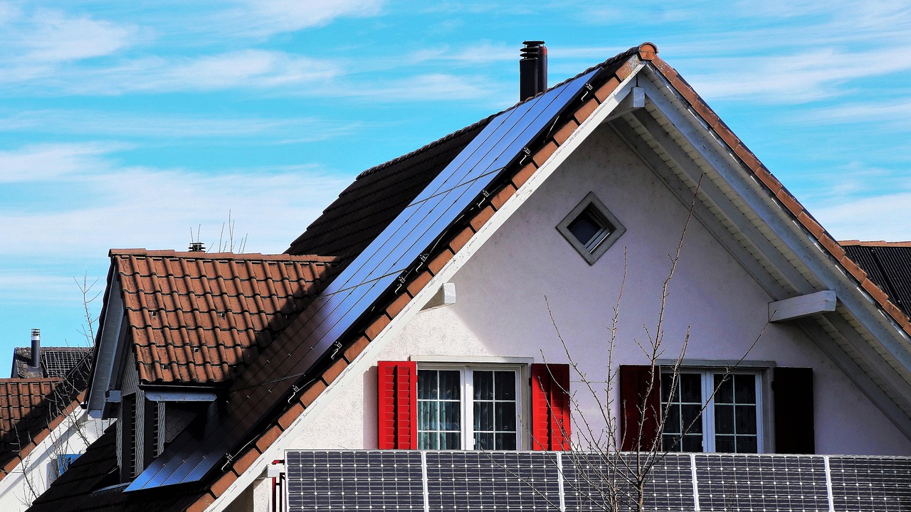 Top of a house. Solar panels on roof. Image by Pixabay