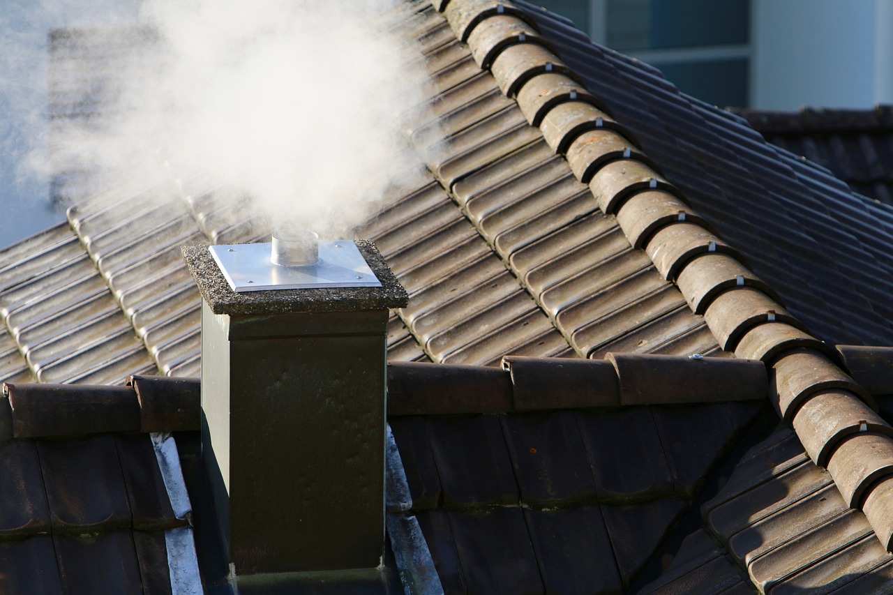 Smoking chimney on a roof