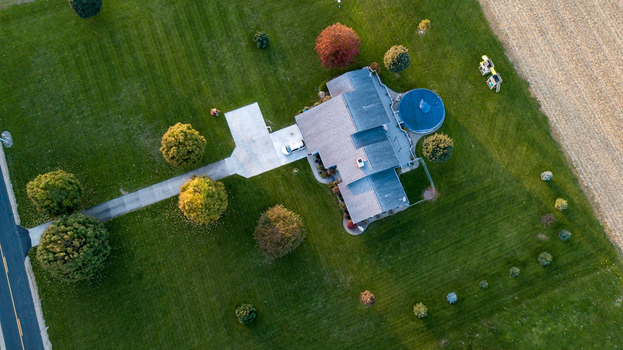 Aerial photography of a gray house with a complex roof structure