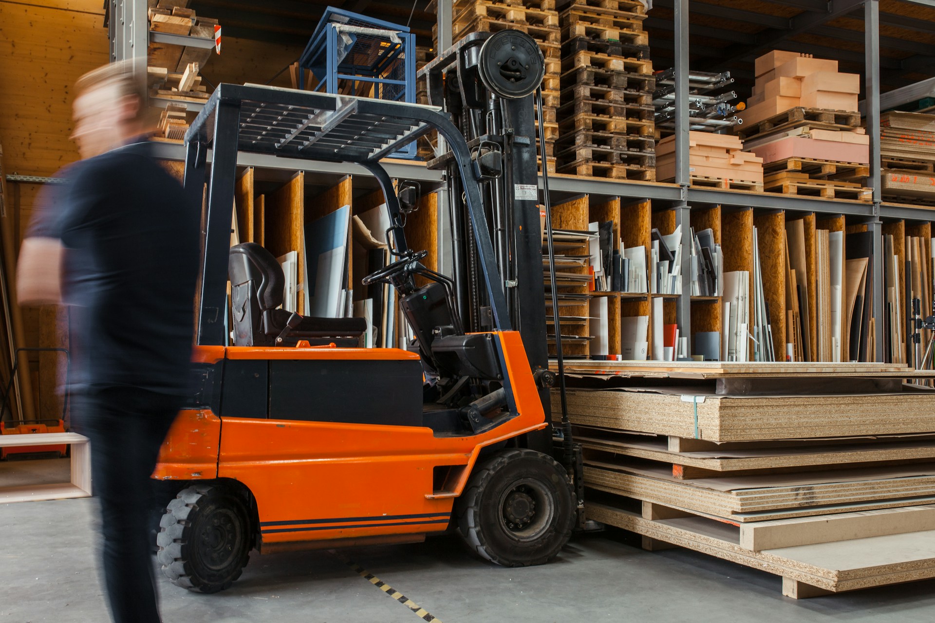 A forklift ready to pick up wood