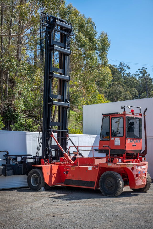 A forklift ready to pick up wood