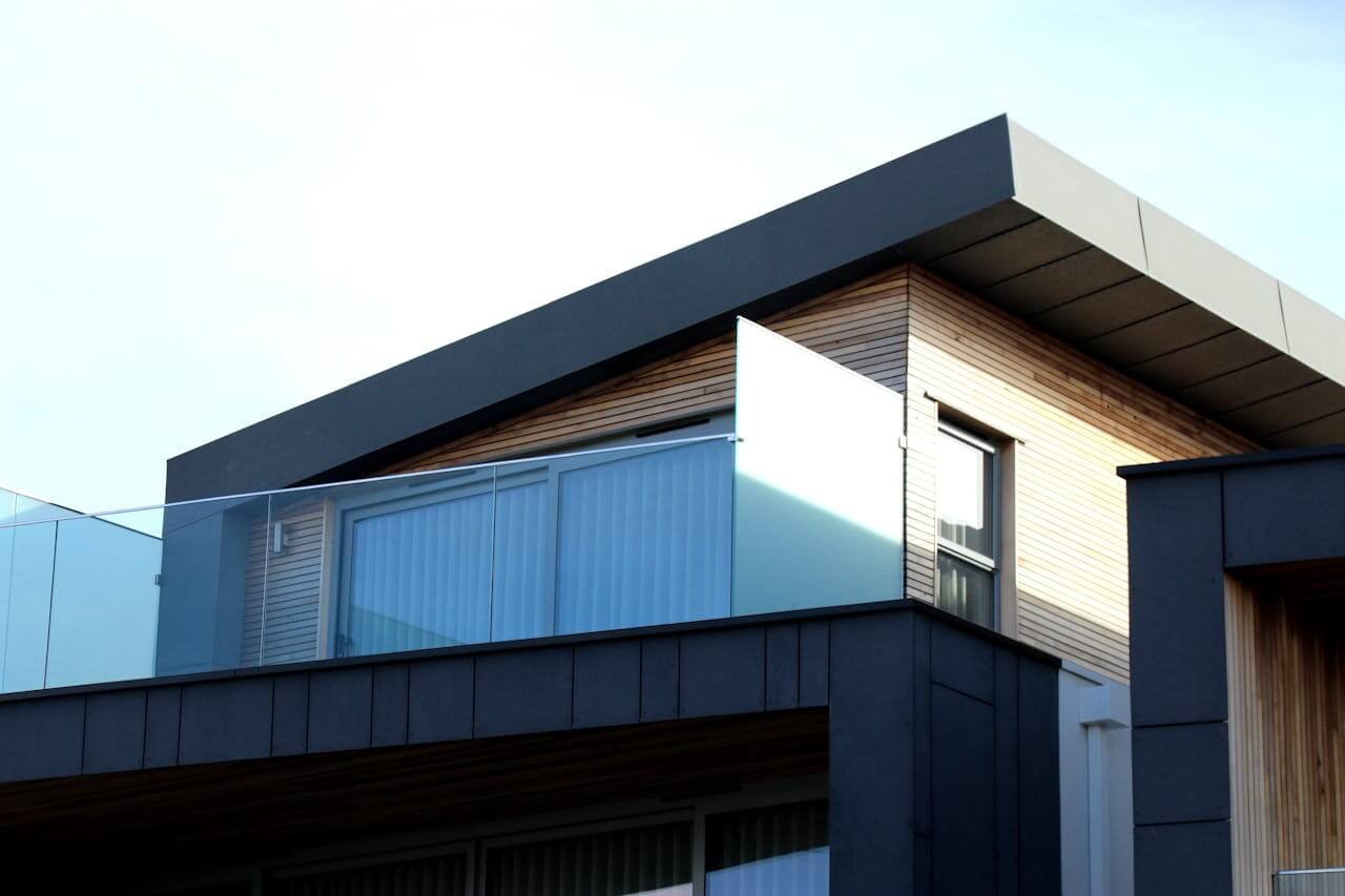 View of a modern building's roof and facade. Image by Pexels