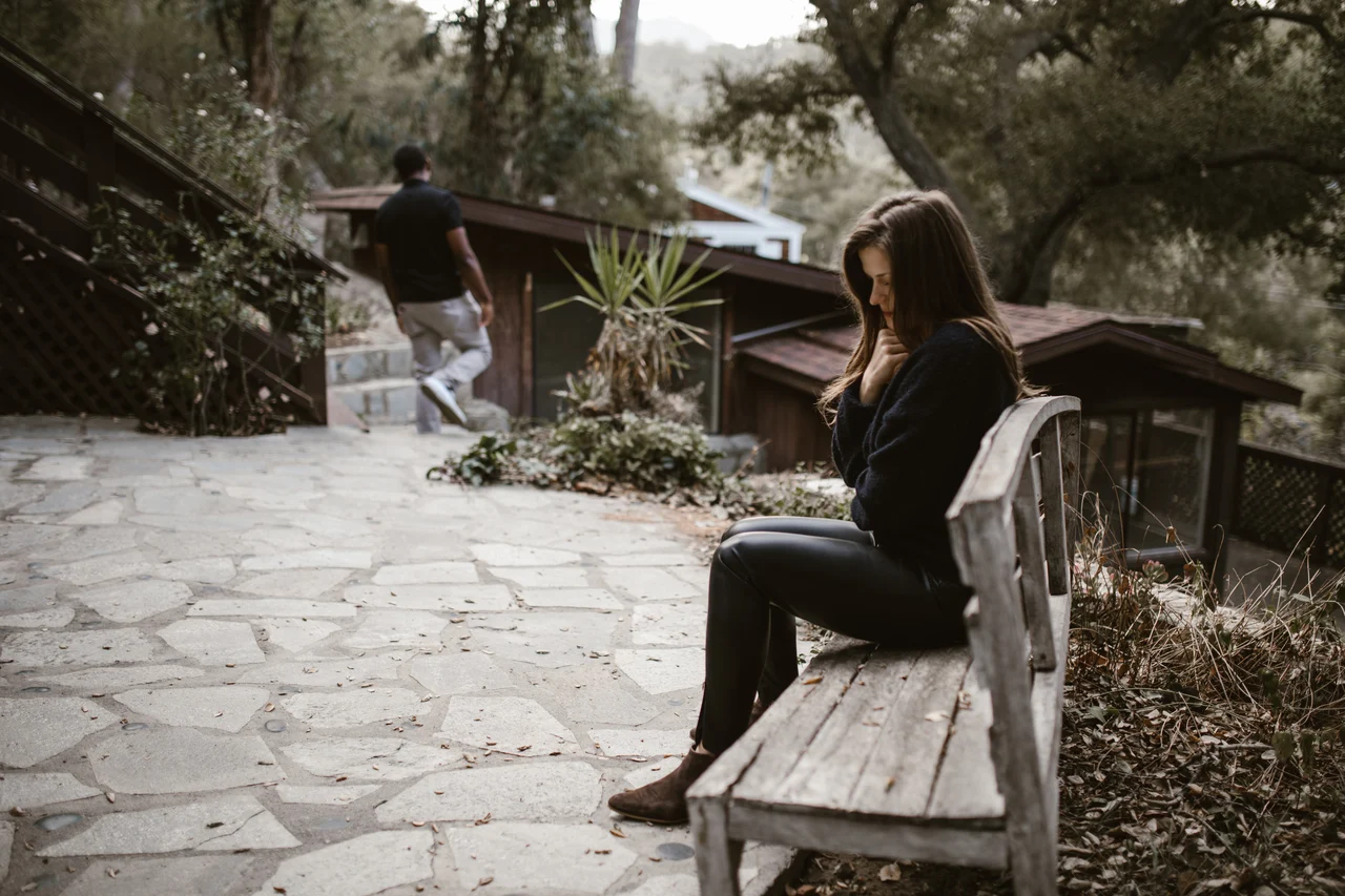 Person sitting alone on a bench. Image by Pexels