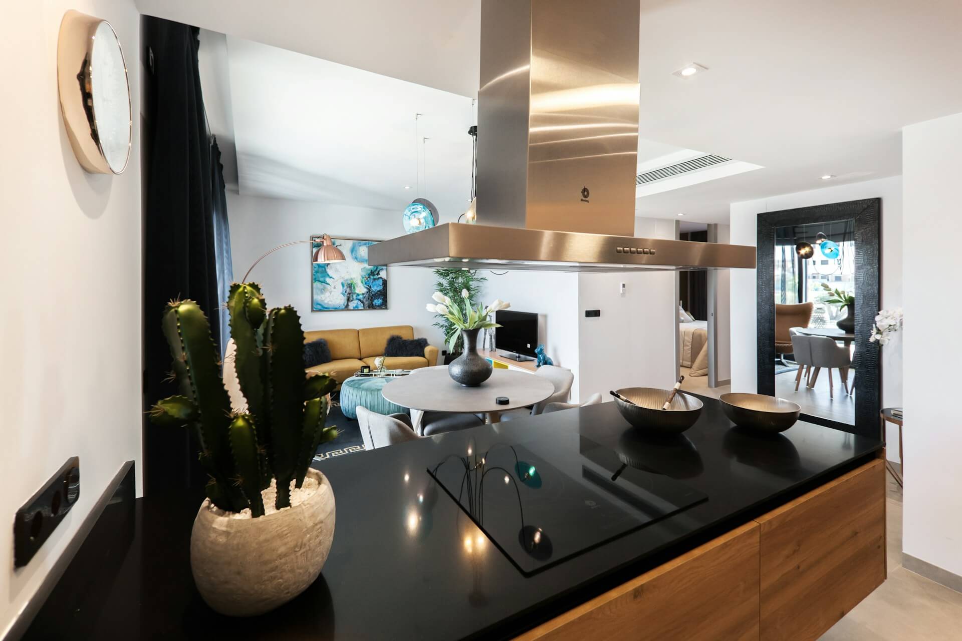 Kitchen island, large fan, livingroom. Image by Unsplash.