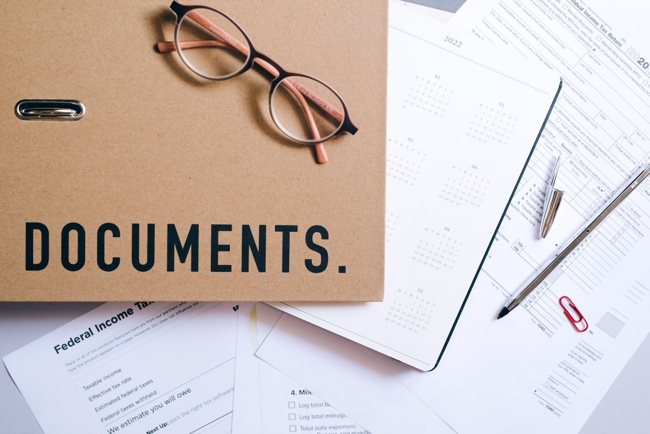 Property records and deed documents reviewed during a Tulsa home closing. Image by Pexels