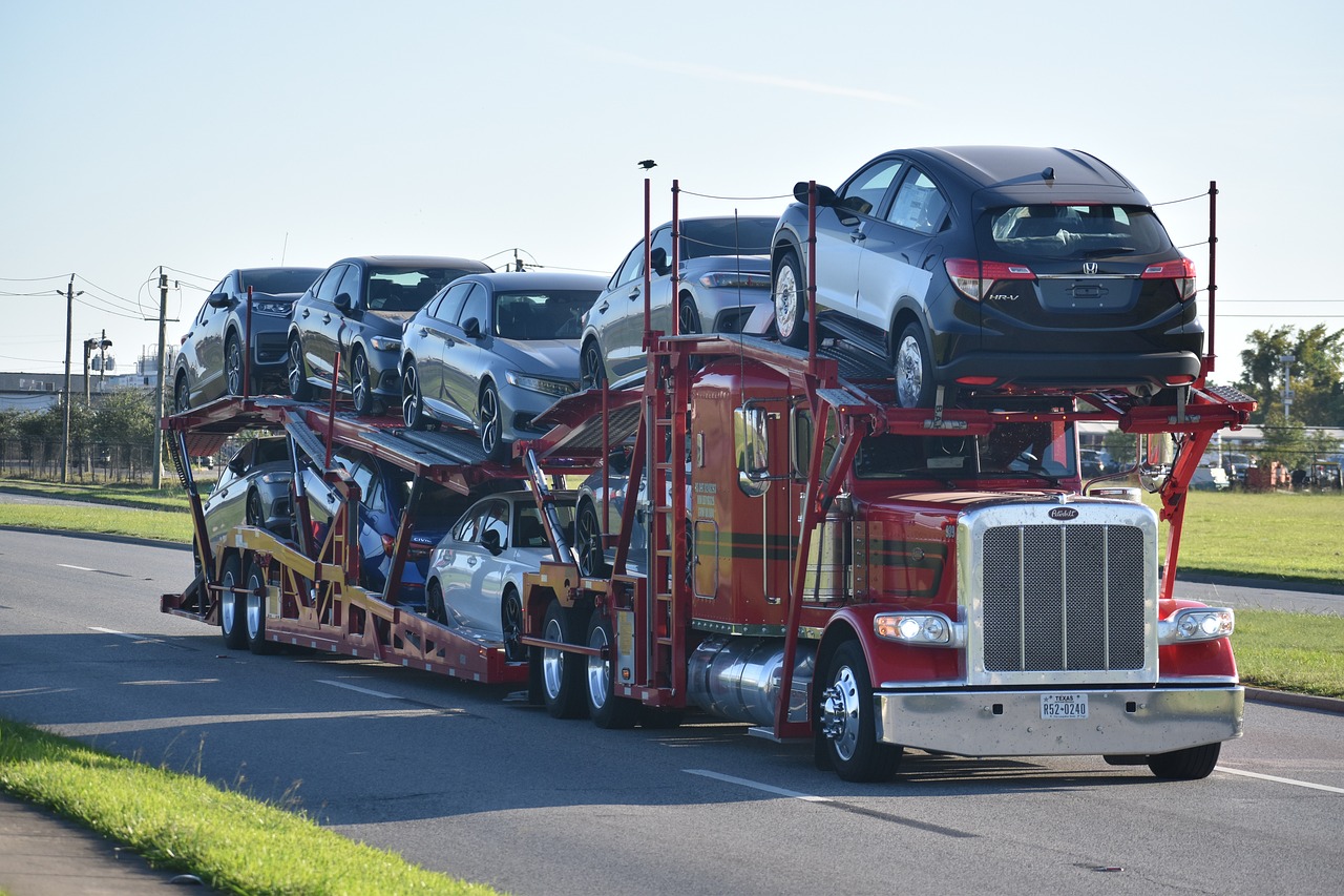 car carrier, lots of cars on a truck