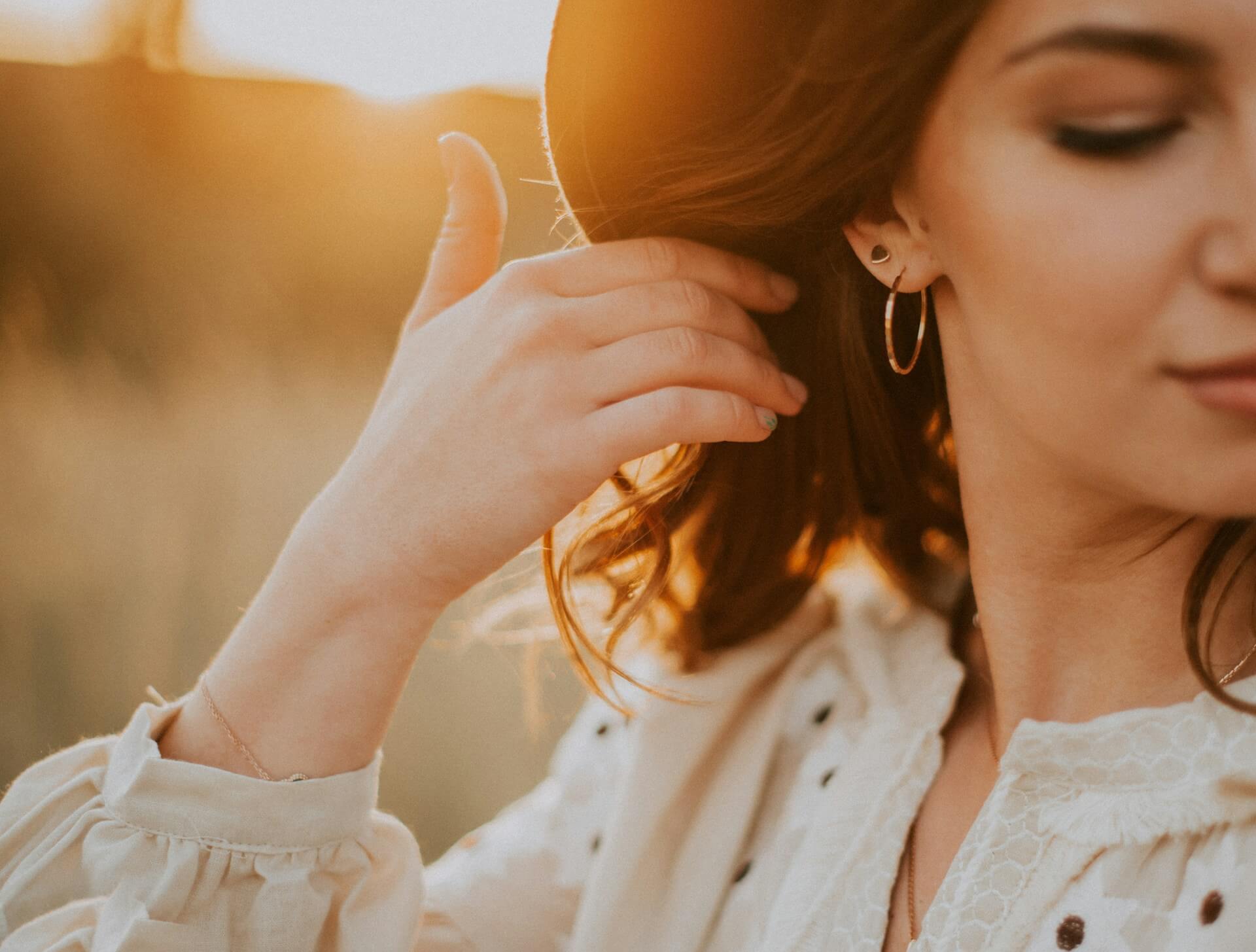 Person wearing earings. Image by Unsplash