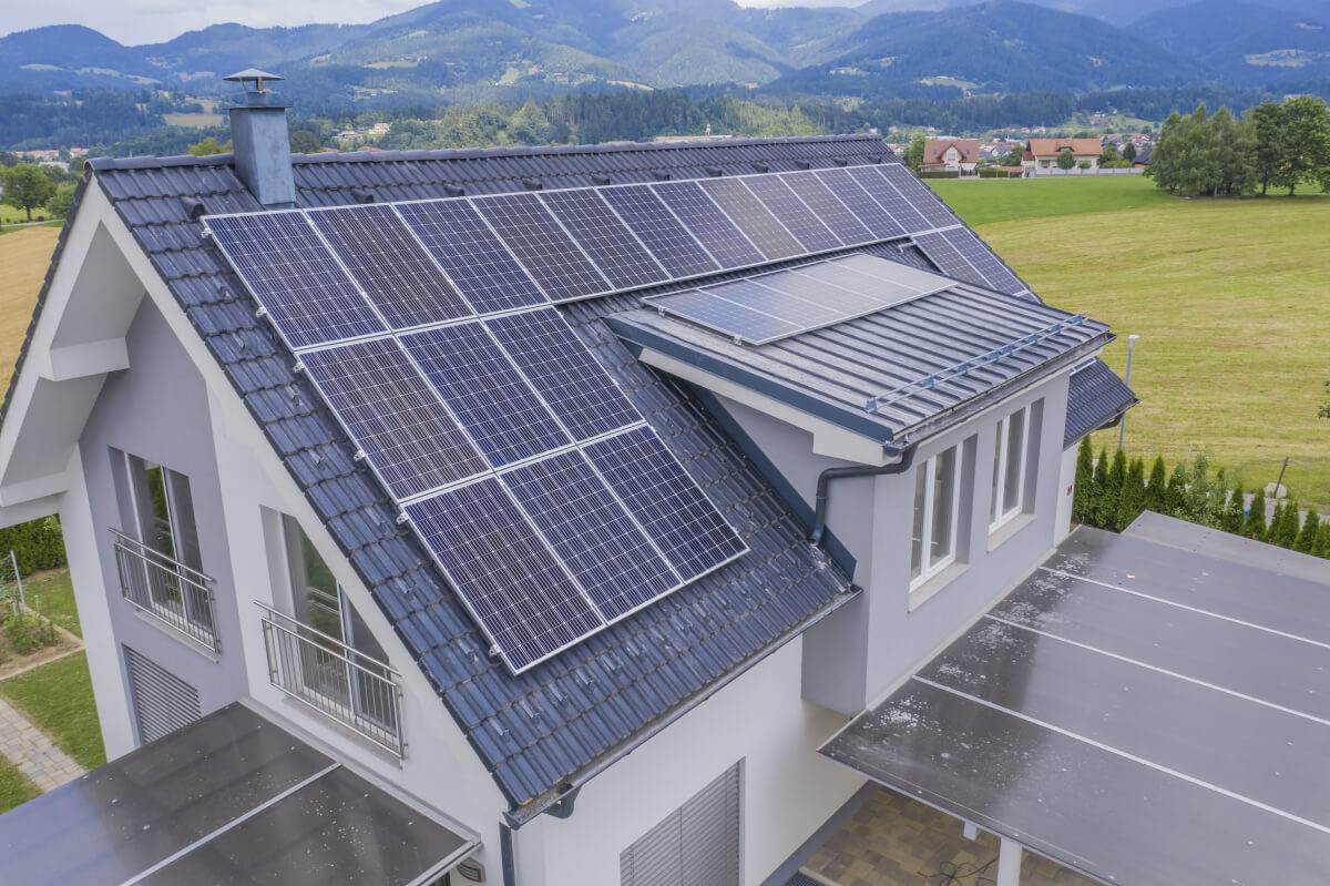 Arial view of a house with solar panels on the roof