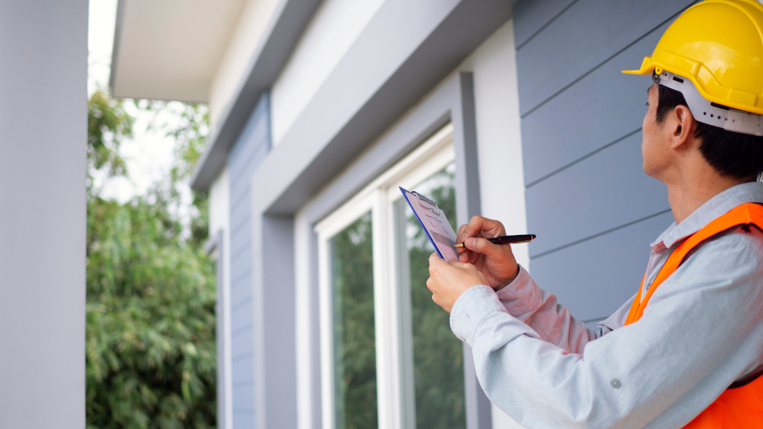 person taking notes during a home inspection