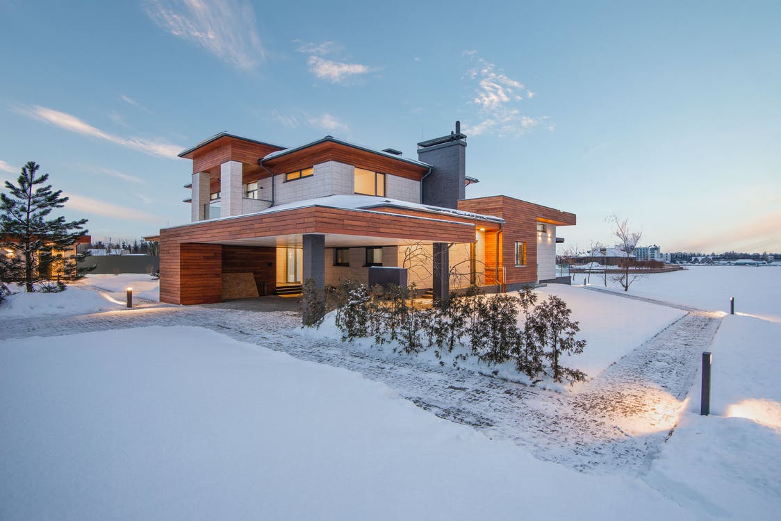Modern cottage house, snow on the ground