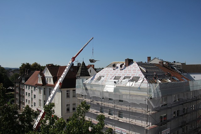 construction, people putting on a new roof