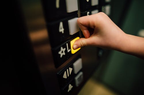 Pressing a buton in an elevator