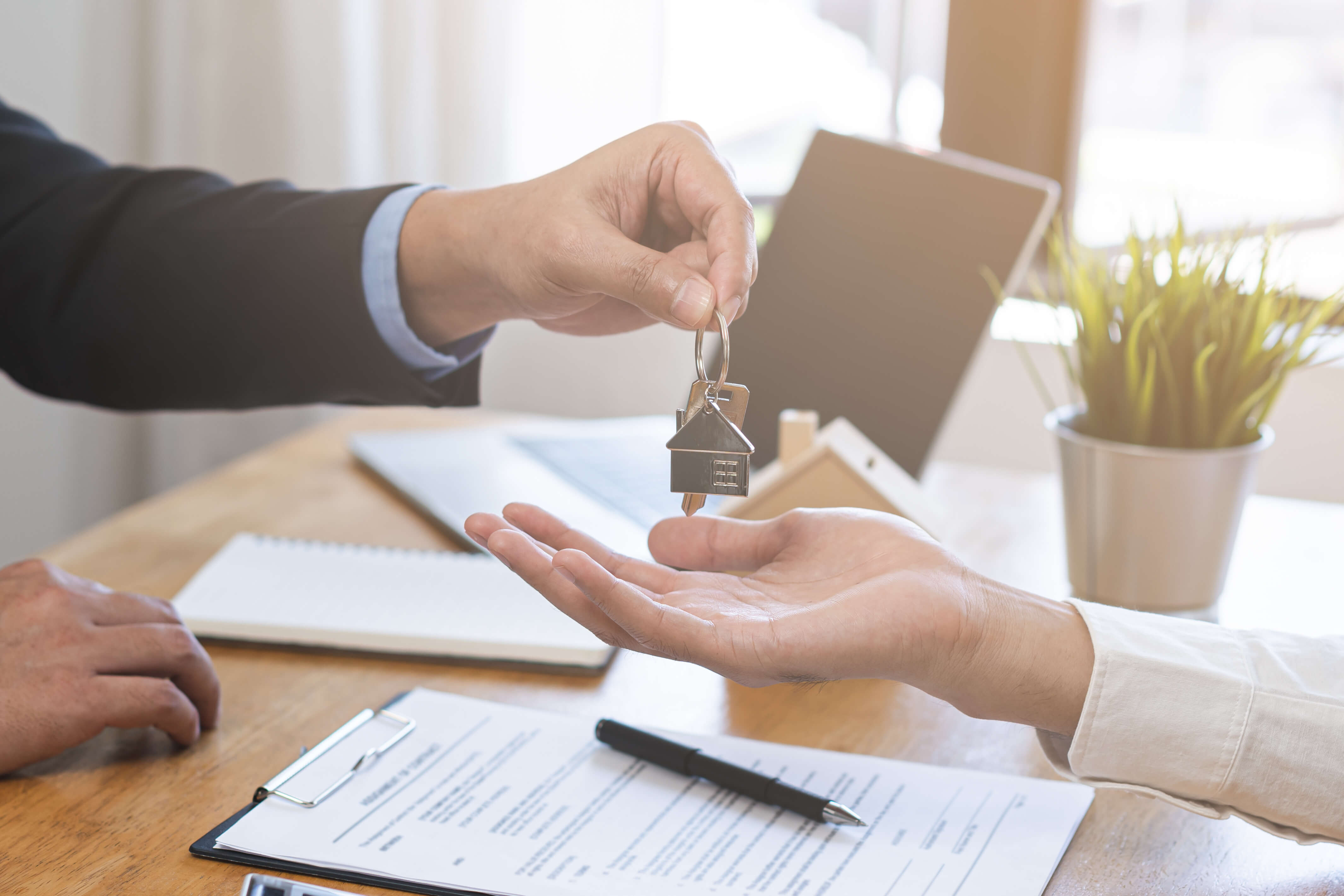 Person handing over keys.