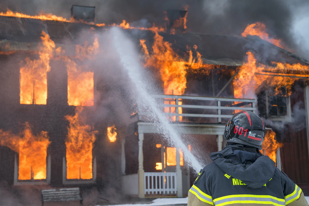 Firefighter, house on fire