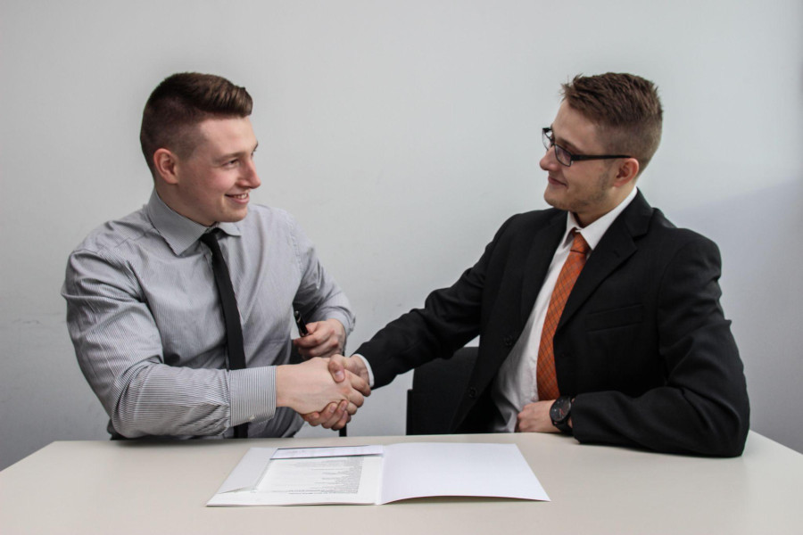 two people shaking hands