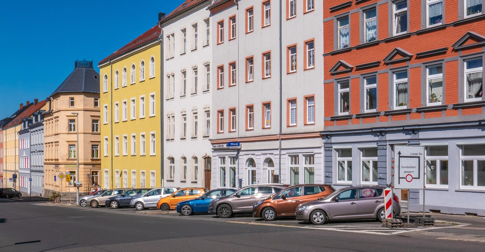 Different color apartment buildings in a row