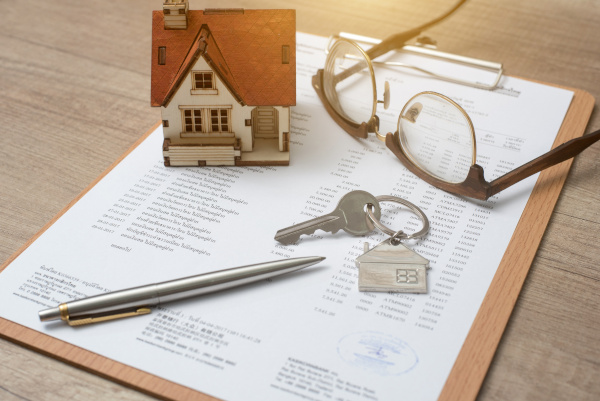 House, glasses, keys, pen, paper