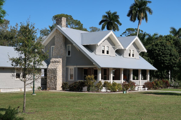 house with large yard, palm trees