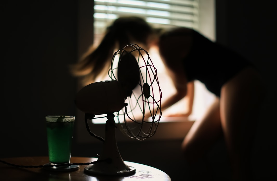 Fan blowing, person in the background