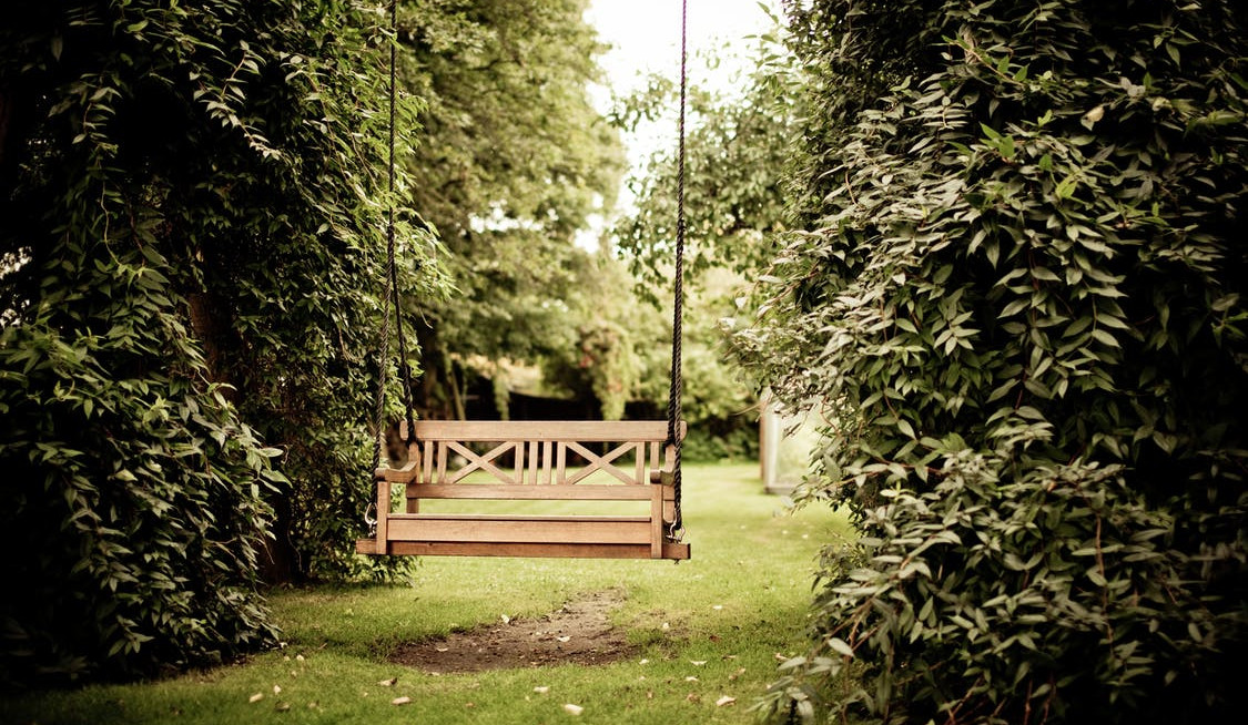 Bench swing in a garden